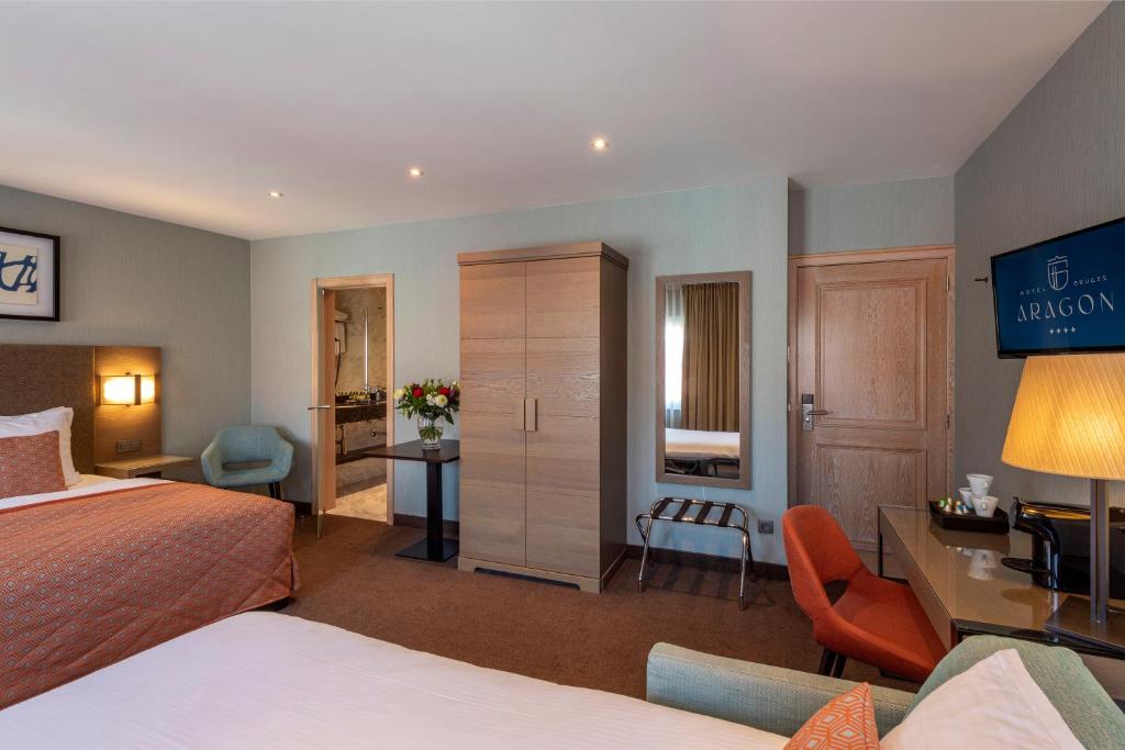 Una cama o camas en una habitación de Hotel Aragon