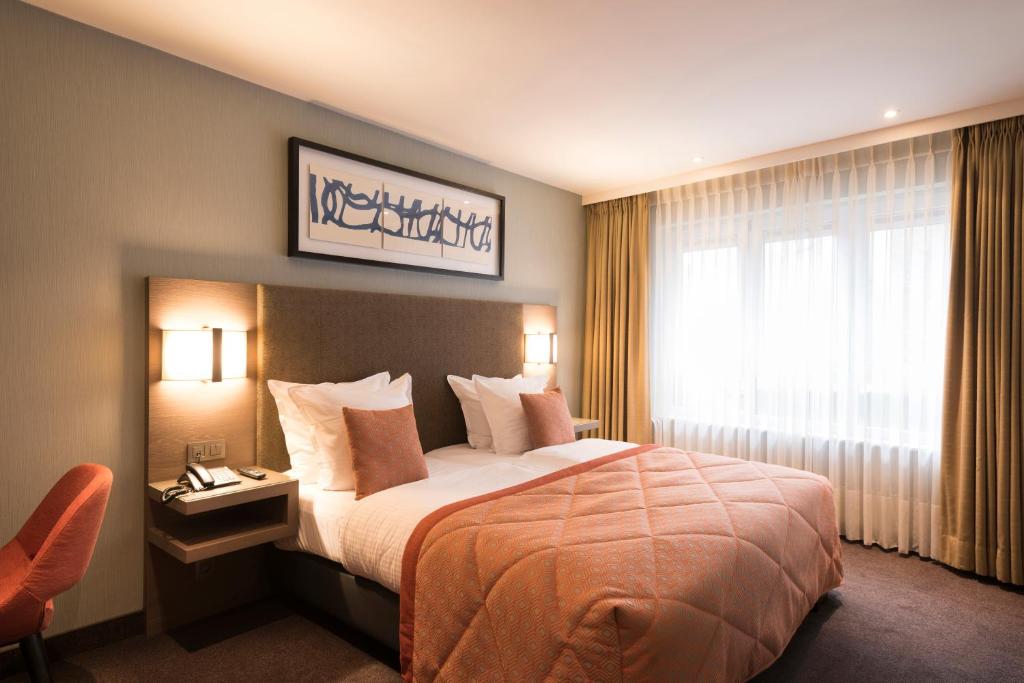 Una cama o camas en una habitación de Hotel Aragon