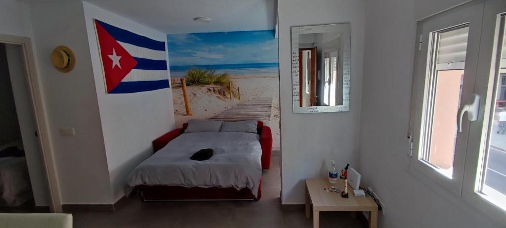 Postel nebo postele na pokoji v ubytování El Rinconcito Cubano en la playa