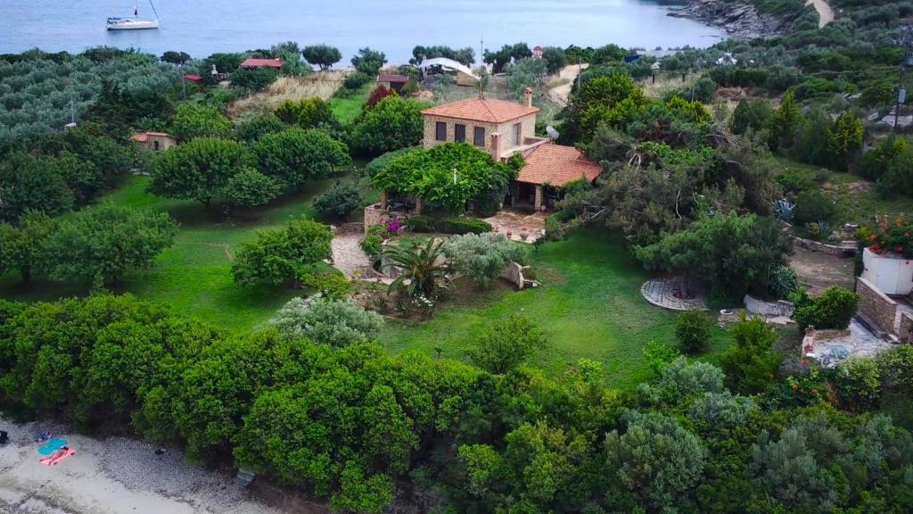 an aerial view of a house on the beach at The Seacret Beachfront Villa in Nea Peramos