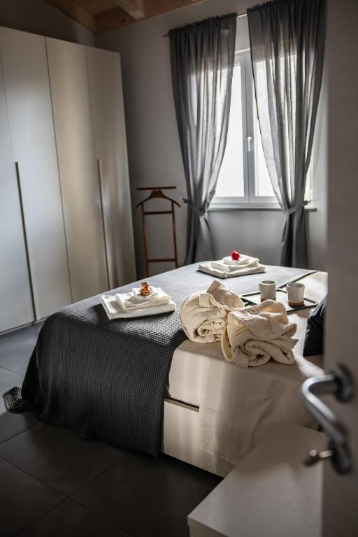 Postel nebo postele na pokoji v ubytování Monte Moro Gavi B&B