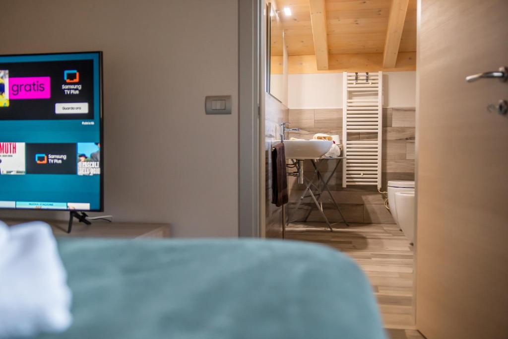 Postel nebo postele na pokoji v ubytování Monte Moro Gavi B&B