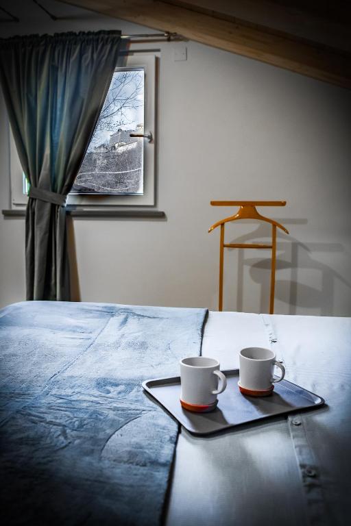 Postel nebo postele na pokoji v ubytování Monte Moro Gavi B&B