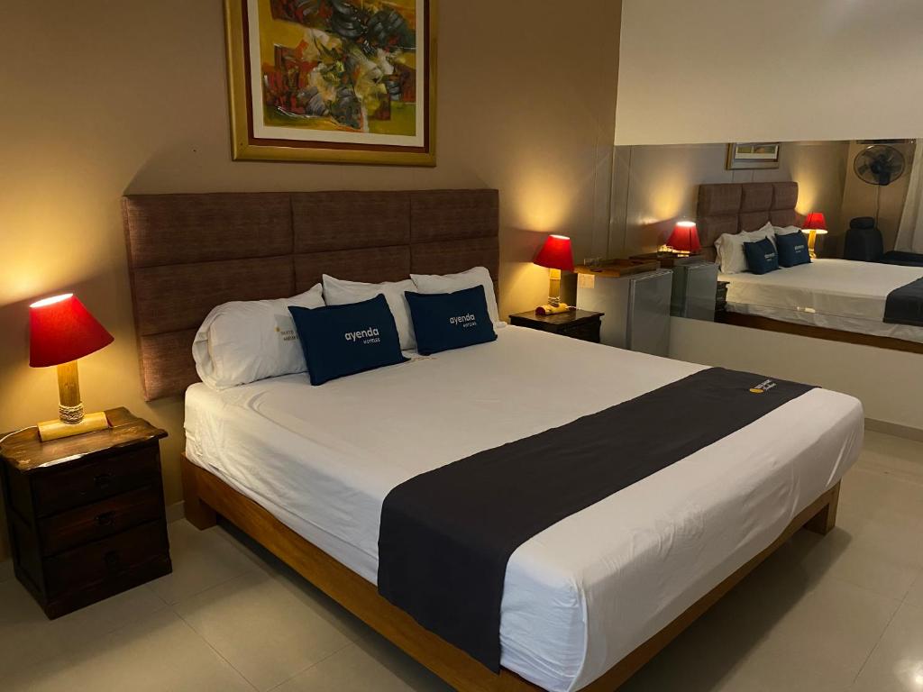 Voodi või voodid majutusasutuse Suite Apart Miraflores toas