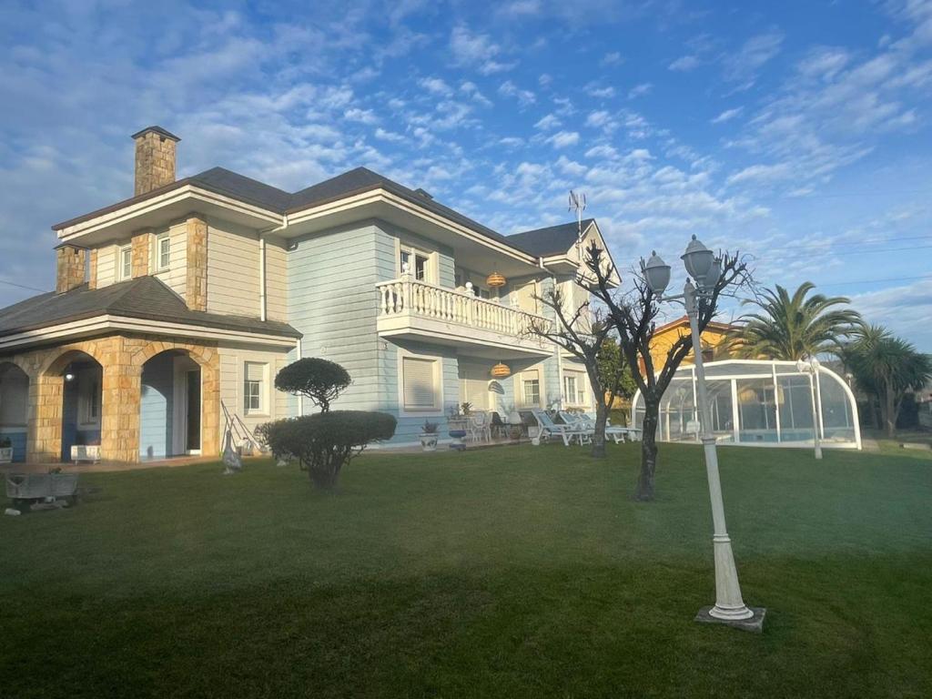 a large house with a porch and a lawn at Casa Begoña - 7803 in Castillo