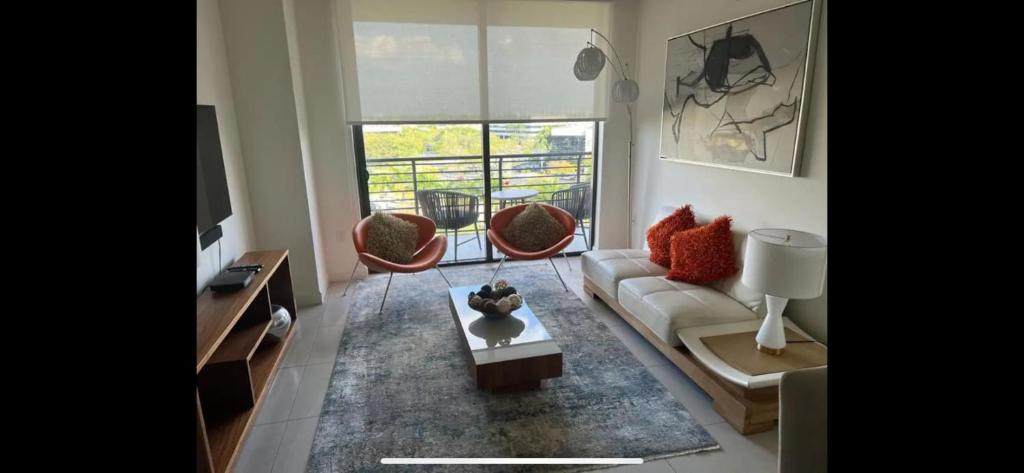 a living room with a couch and two chairs at 2 bed 2 bath Luxury Condo in Miami