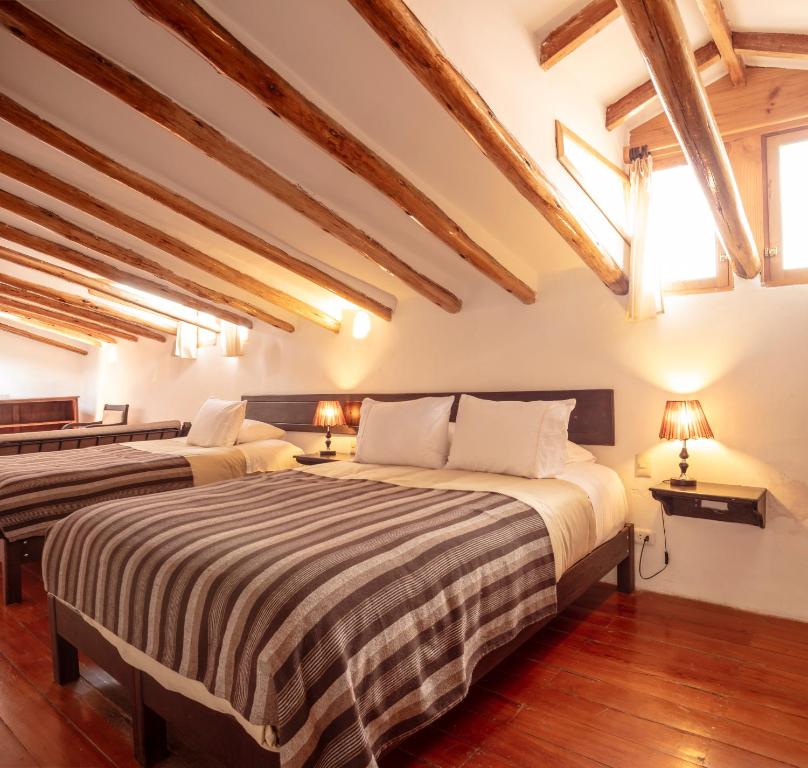 Postel nebo postele na pokoji v ubytování SAMANA B&B