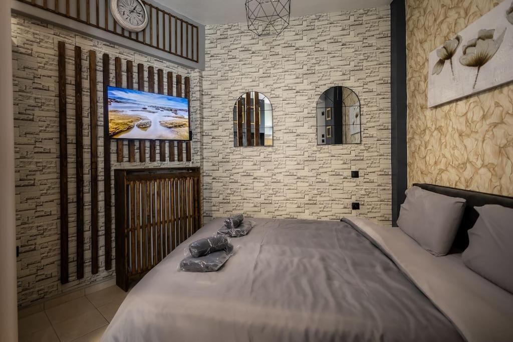 Ένα ή περισσότερα κρεβάτια σε δωμάτιο στο GpxClr GuestSuiteNo2
