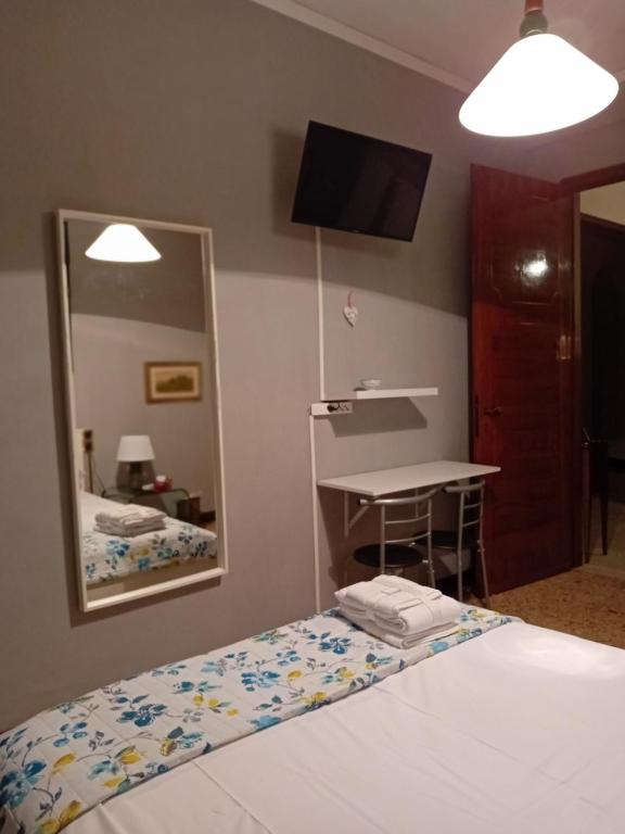 Postel nebo postele na pokoji v ubytování B&B CALIFANO- 2 Leoni