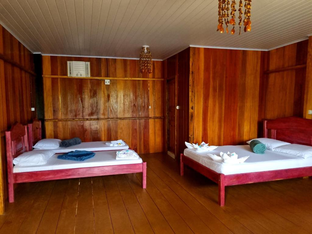 Postel nebo postele na pokoji v ubytování POUSADA DA DRI LODGE