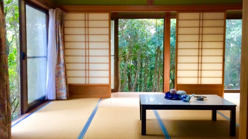 a room with a table and a large window at Shimanto Yamamizuki - Vacation STAY 36946v in Shimanto
