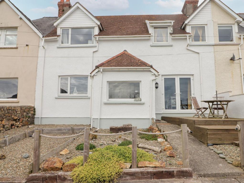 a house with a garden in front of it at Harbour Village Views in Goodwick