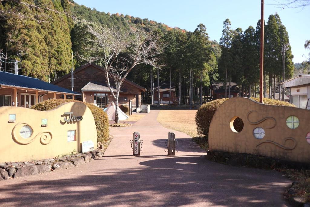 a street with a building with a bunch ofitures at Toso Youth Travel Village - Vacation STAY 30470v 