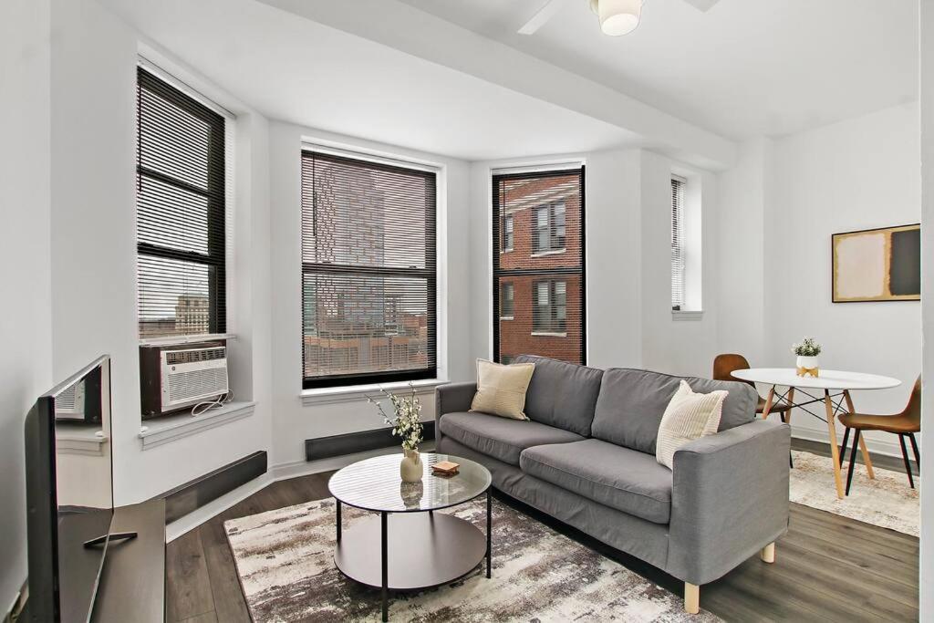 a living room with a couch and a table at 1BR Modern Apartment in Chicago - Del Prado 811 in Chicago