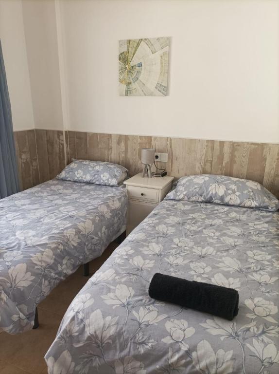 Postel nebo postele na pokoji v ubytování Apartamento con piscina y terraza con vista al mar