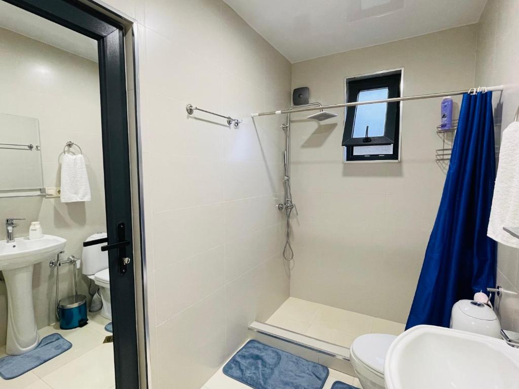 a bathroom with a shower and a toilet and a sink at maria house _2 in Kutaisi