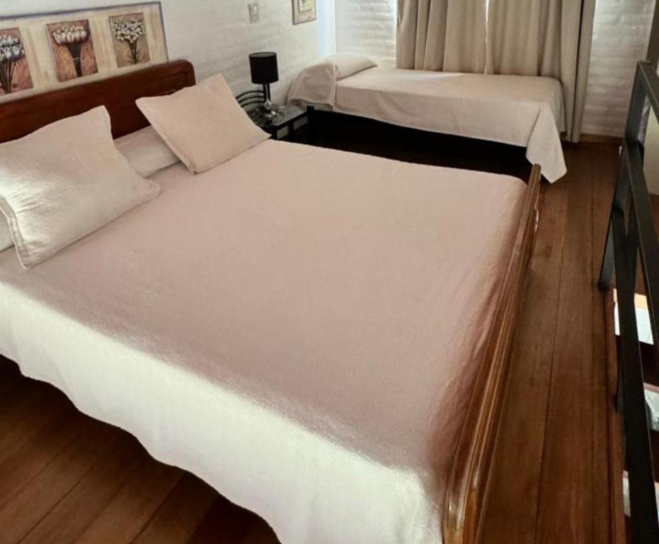 Ein Bett oder Betten in einem Zimmer der Unterkunft Bungalows Bella Vista