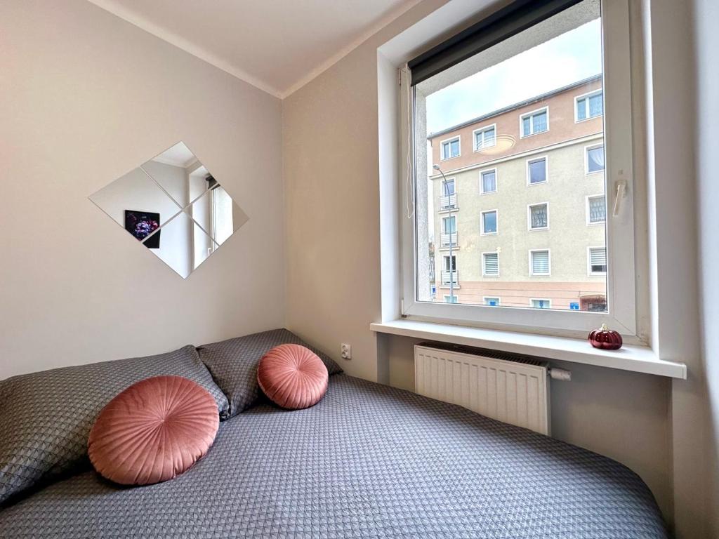 Postel nebo postele na pokoji v ubytování MMRent Flower Room