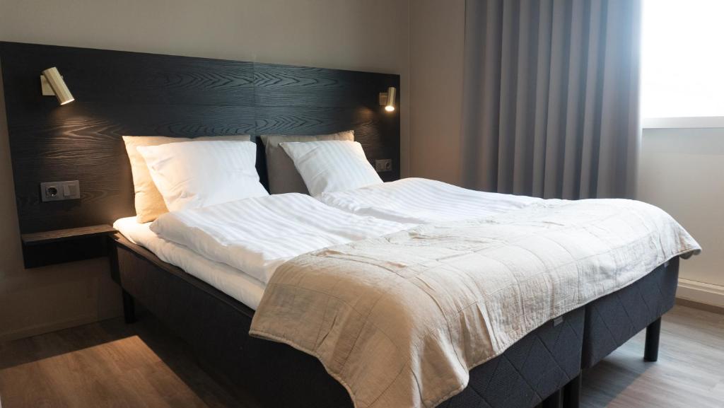 Postel nebo postele na pokoji v ubytování Hotel Nørreport