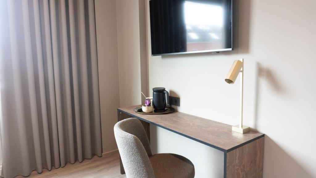TV a/nebo společenská místnost v ubytování Hotel Nørreport
