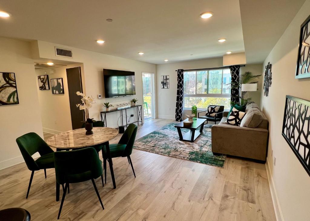 a living room with a table and a couch at Century City Chic 4 sleep free parking 402 in Los Angeles