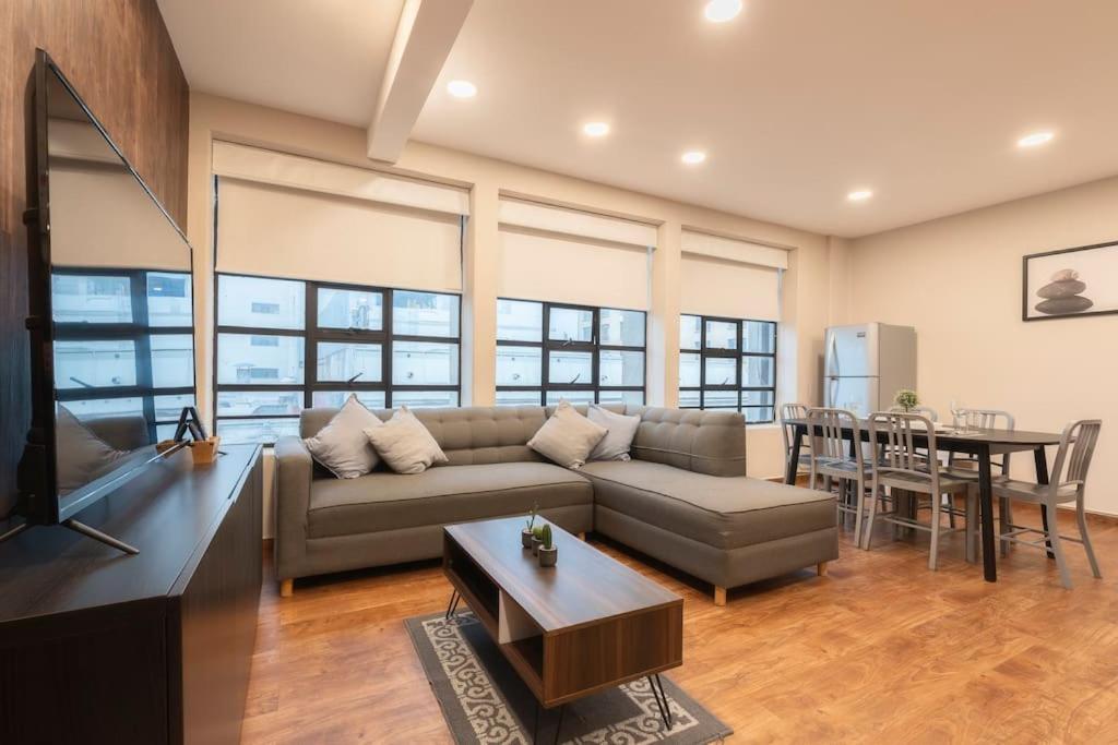 a living room with a couch and a table at 401 Location 3Bdrm 2bath apt with AC Rooftop in Mexico City