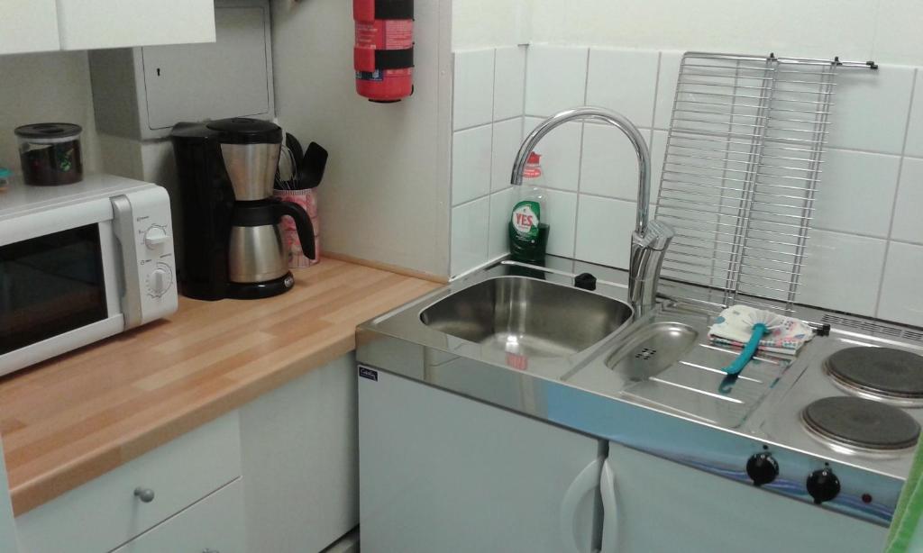 Kuchyň nebo kuchyňský kout v ubytování Lilla Hotellet