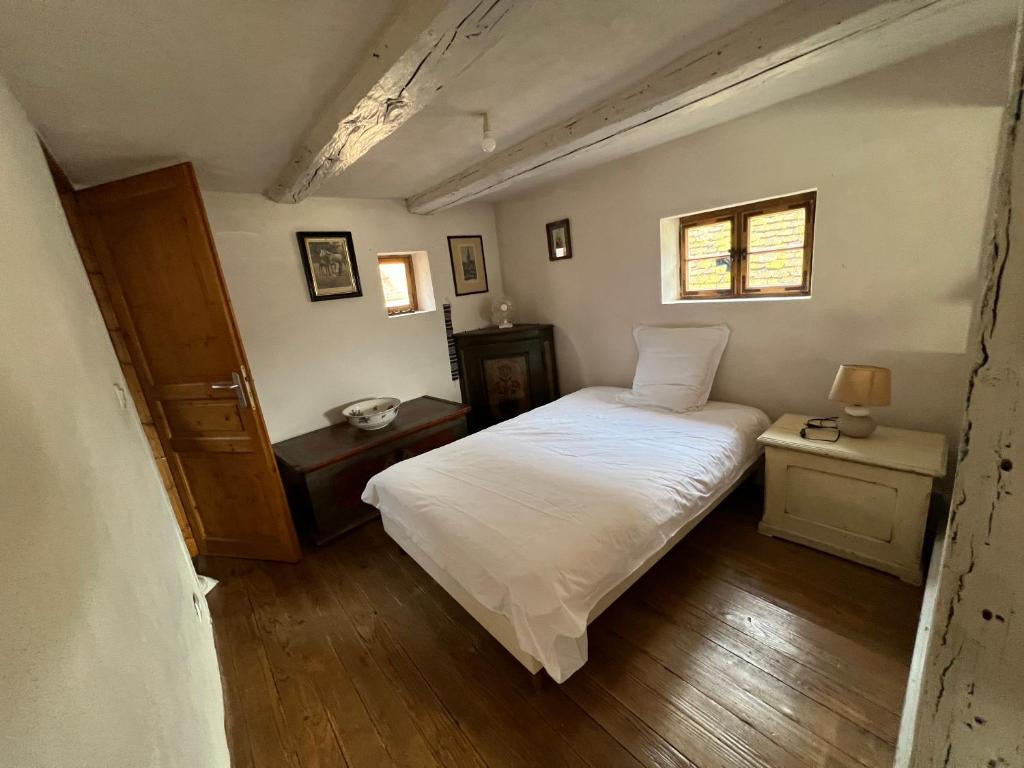 Postel nebo postele na pokoji v ubytování Gîte du Brocanteur