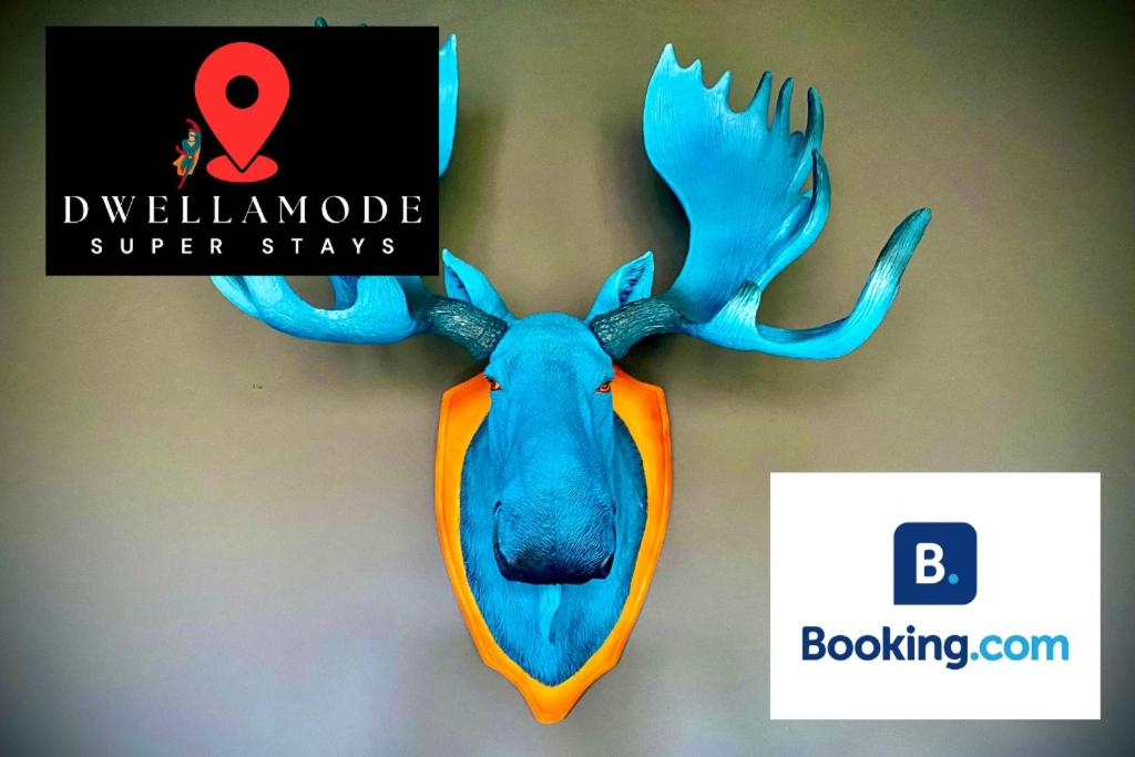 a fake moose head hanging on a wall at 3 Bedroom House -Sleeps 6- Big Savings On Long Stays! in Canterbury