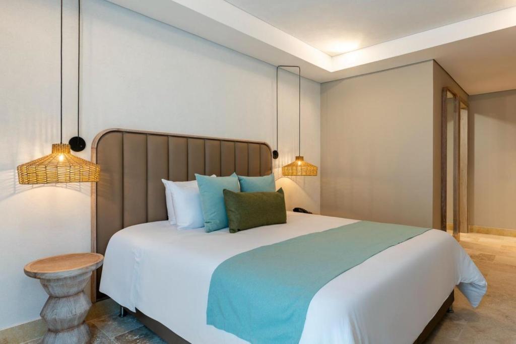Postel nebo postele na pokoji v ubytování Oz Hotel Cartagena