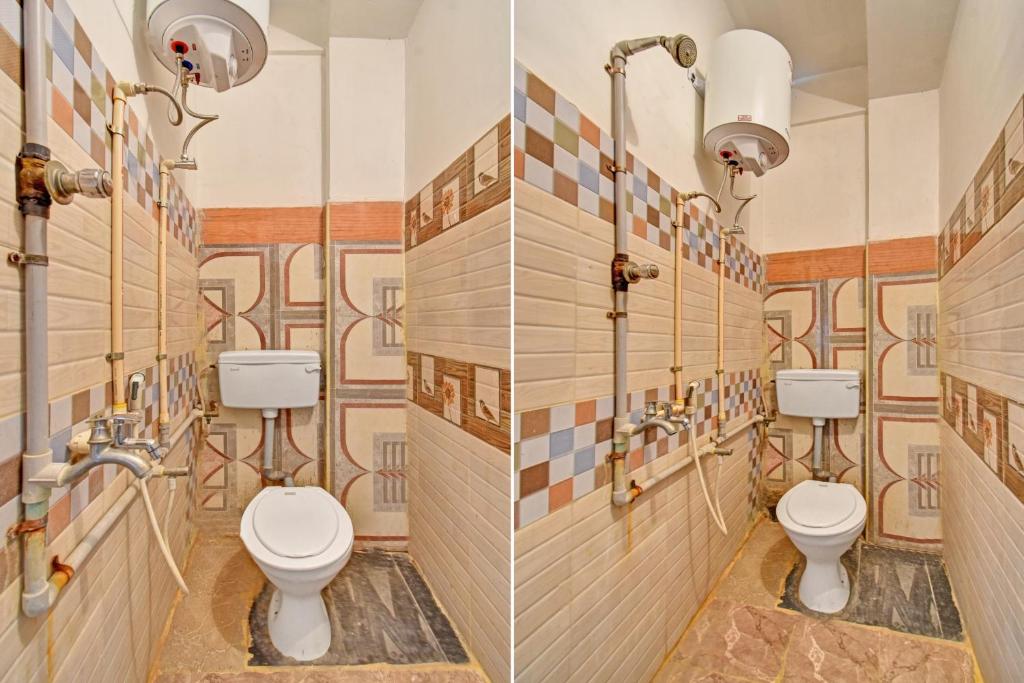 a bathroom with three toilets and tiles on the walls at OYO Flagship R.K.R Residency in Chennai