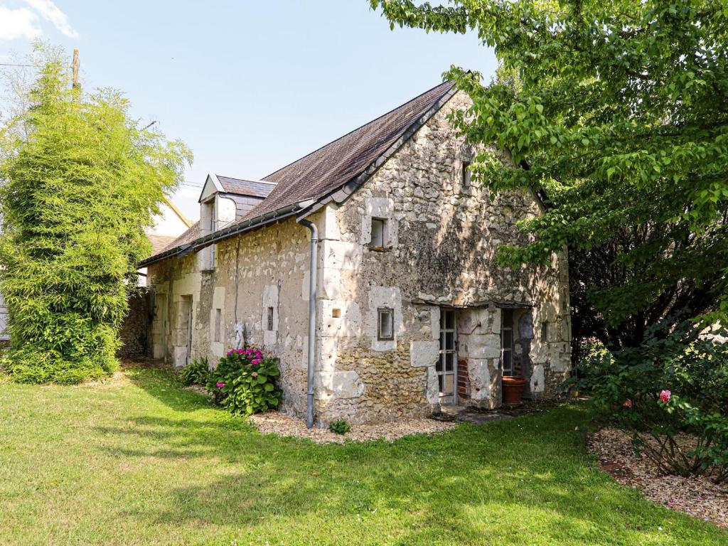 an old stone building with a yard and trees at Gîte Mayet, 2 pièces, 4 personnes - FR-1-410-438 in Mayet