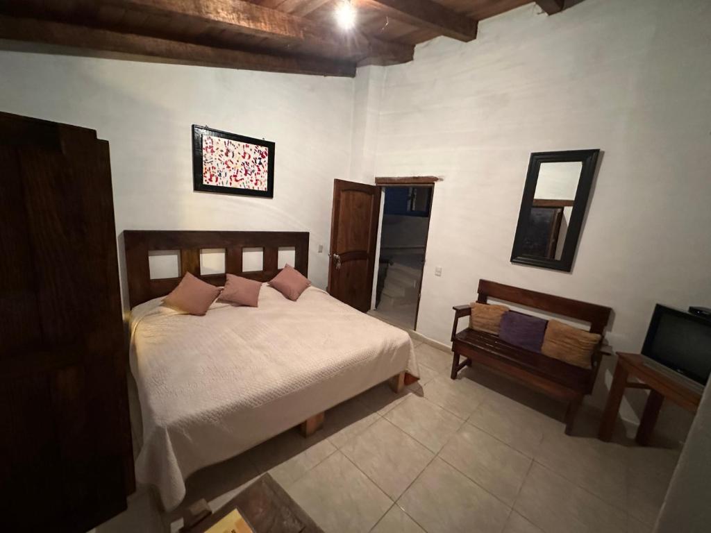Postel nebo postele na pokoji v ubytování Hotel del Pozo
