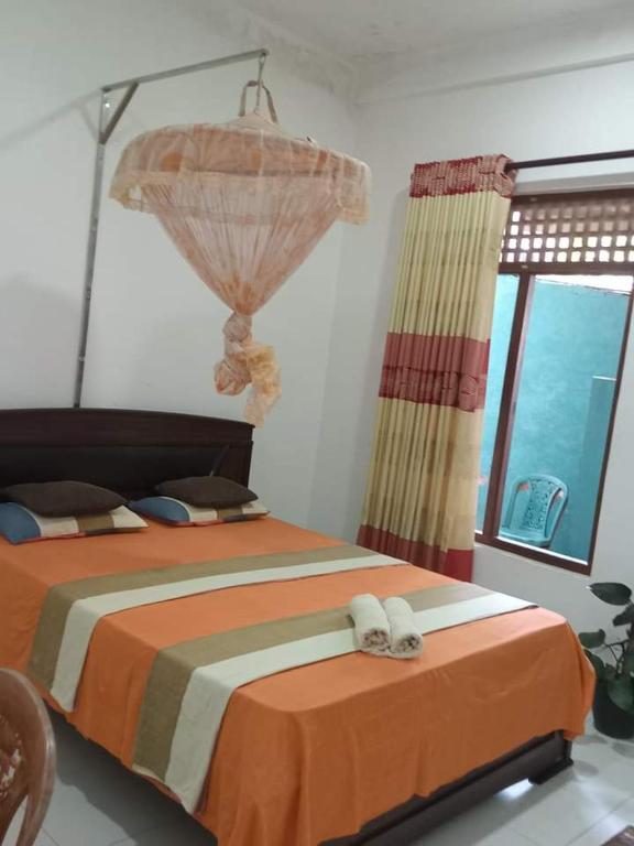 Postel nebo postele na pokoji v ubytování Dinimuthu Rest Inn