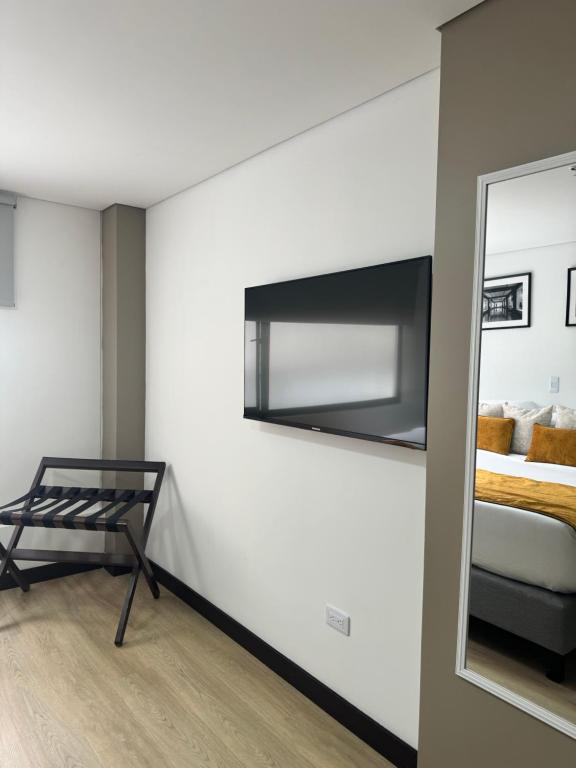 Postel nebo postele na pokoji v ubytování Hotel WLH Gold Bogota