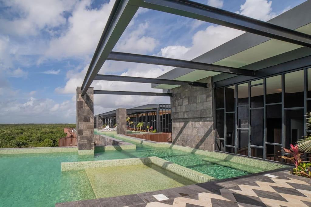 a view of a house with a swimming pool at Tulum Sea View Rooftop BrandNew 1BR in Tulum