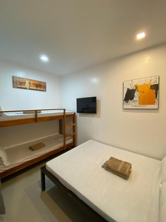 Postel nebo postele na pokoji v ubytování Ati Lodge Boracay