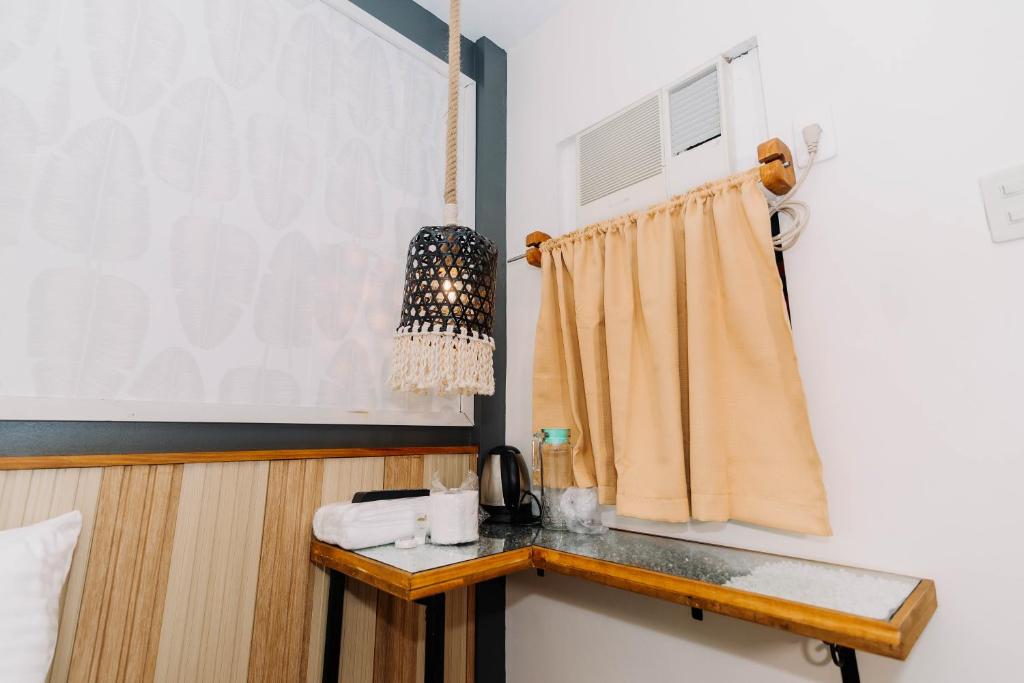 Postel nebo postele na pokoji v ubytování Jovinaj Travellers Inn