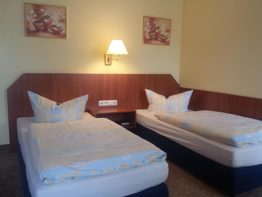 Postel nebo postele na pokoji v ubytování Hotel Evabrunnen