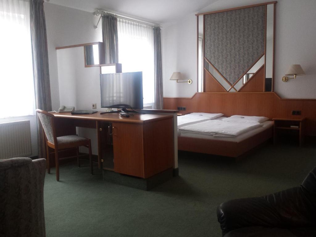 Postel nebo postele na pokoji v ubytování Hotel Evabrunnen