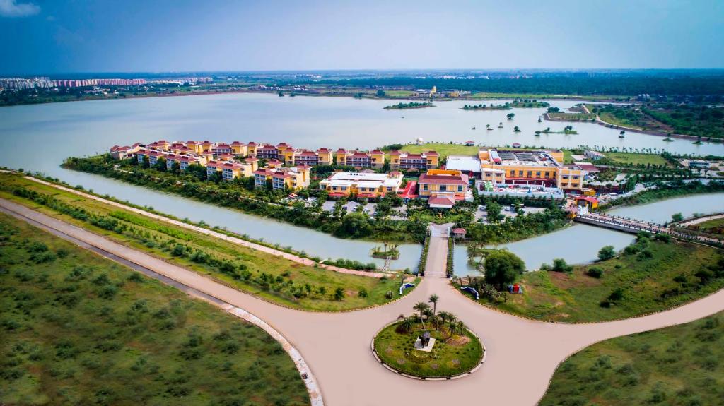 an aerial view of a resort on a river at MAYFAIR Lake Resort in Raipur