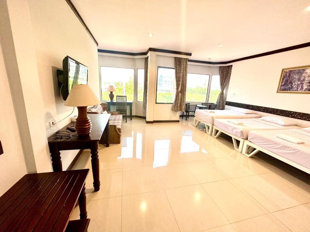 Postel nebo postele na pokoji v ubytování บ้านสวนรีสอร์ท นครสวรรค์