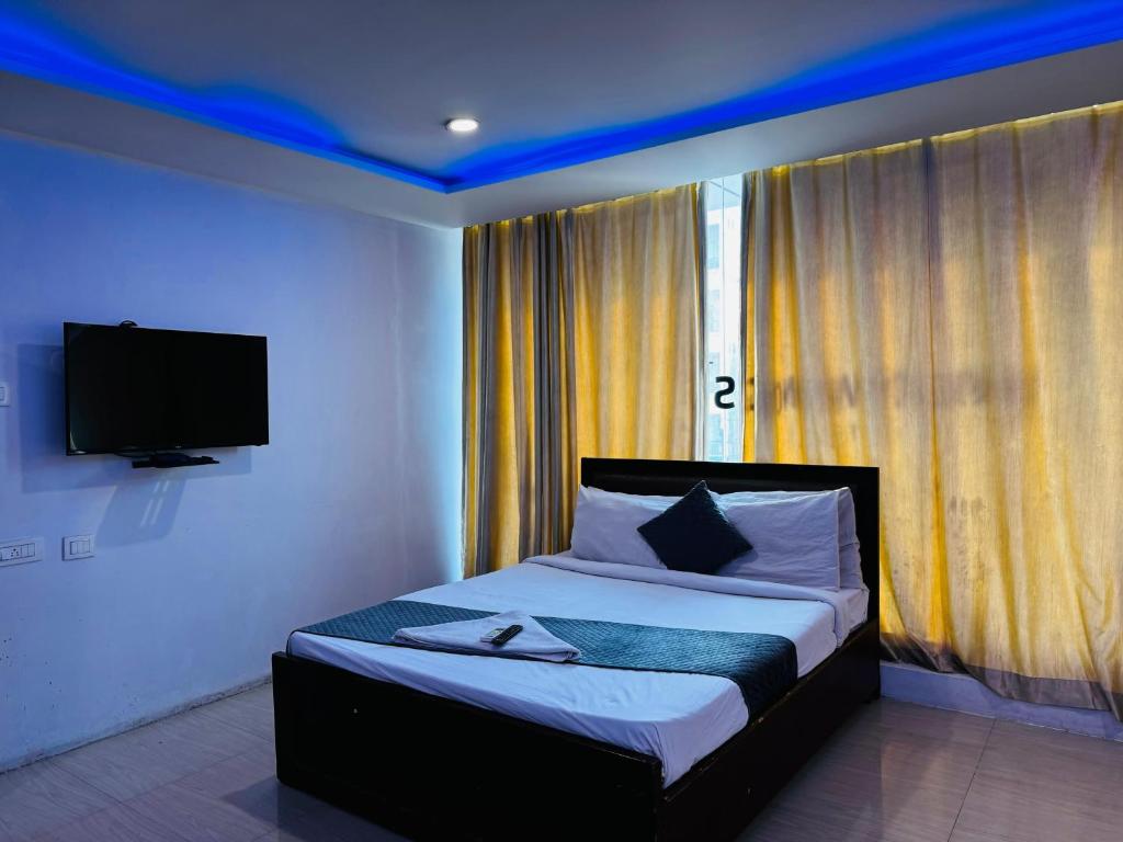 Llit o llits en una habitació de Wildwings hotel