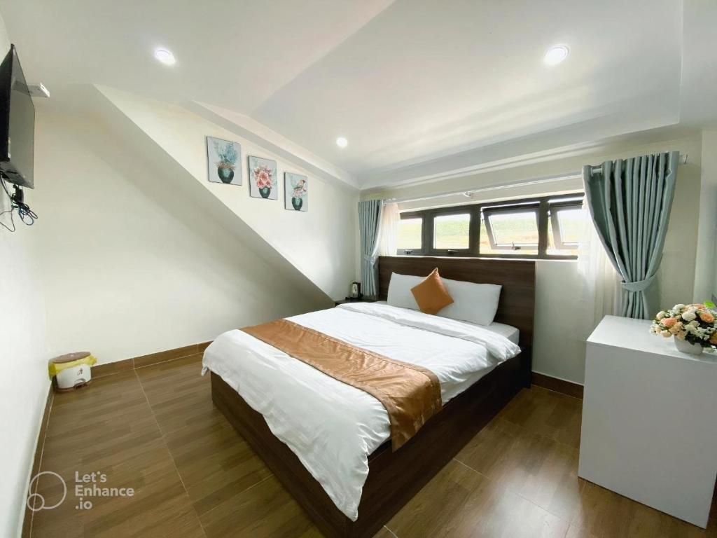Postel nebo postele na pokoji v ubytování Hotel Duy Dũng - Đà Lạt