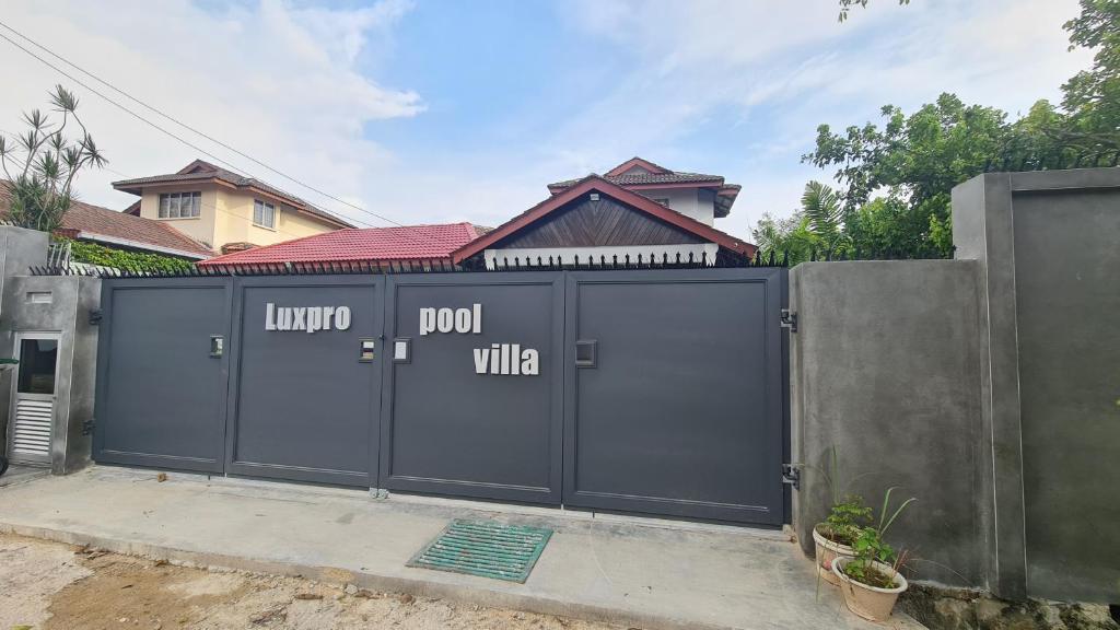 a gate with the words luna riot villa on it at Luxpro Luxury Villa / Seremban 2 / Private Swimming Pool in Seremban
