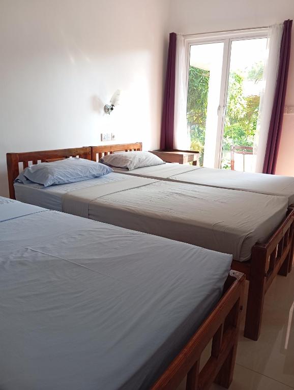 Postel nebo postele na pokoji v ubytování JEYs Place