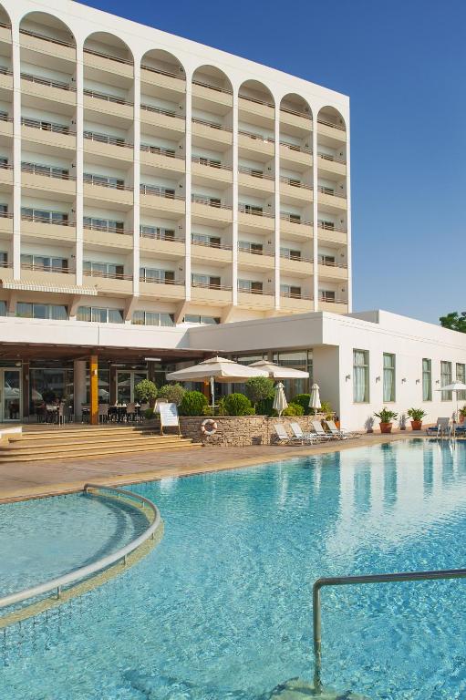 a large swimming pool in front of a hotel at Ajax Hotel in Limassol