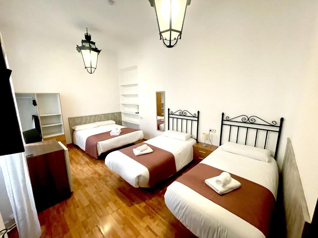 Posteľ alebo postele v izbe v ubytovaní Arteaga Hostal & Baños Arabes Elvira