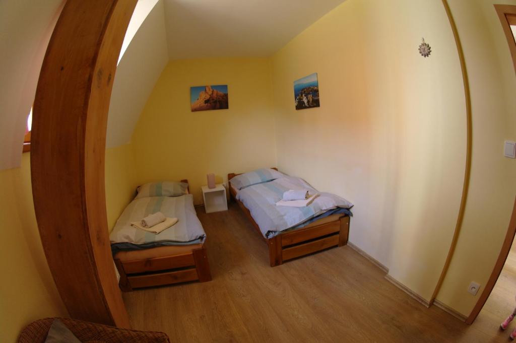 Postel nebo postele na pokoji v ubytování Penzion Hradební