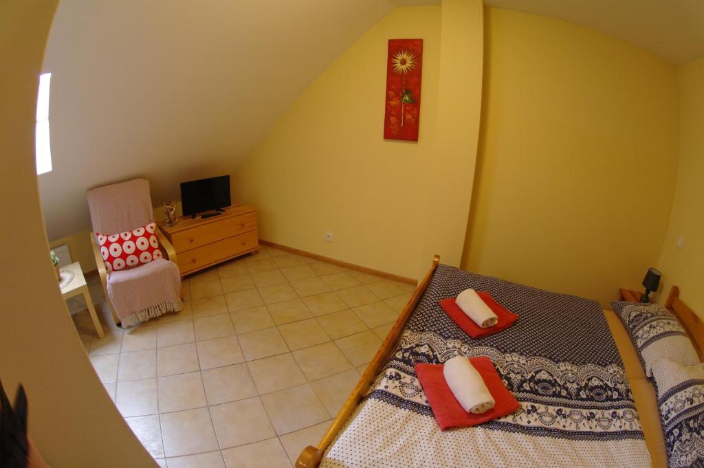 Postel nebo postele na pokoji v ubytování Penzion Hradební